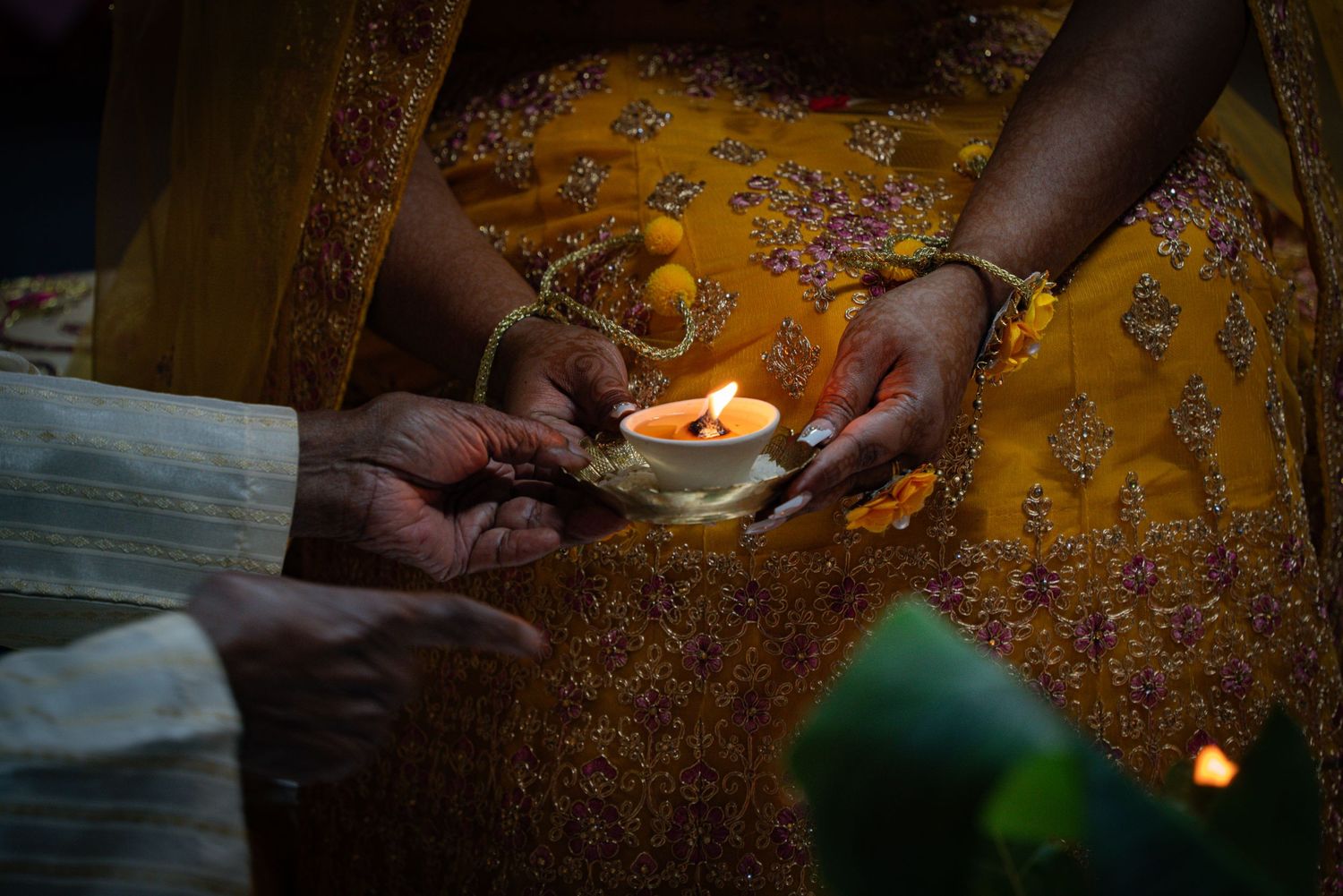Hindu Manticoori ceremony photo of hands holding glowing candle