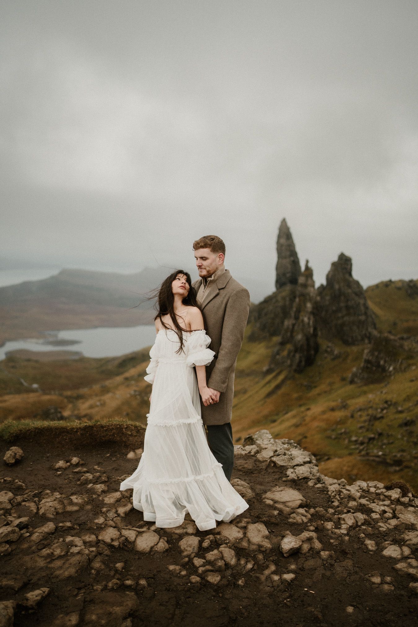 A romantic wedding photoshoot against the dramatic landscape of the Isle of Skye with view over The Old Man of Storr.