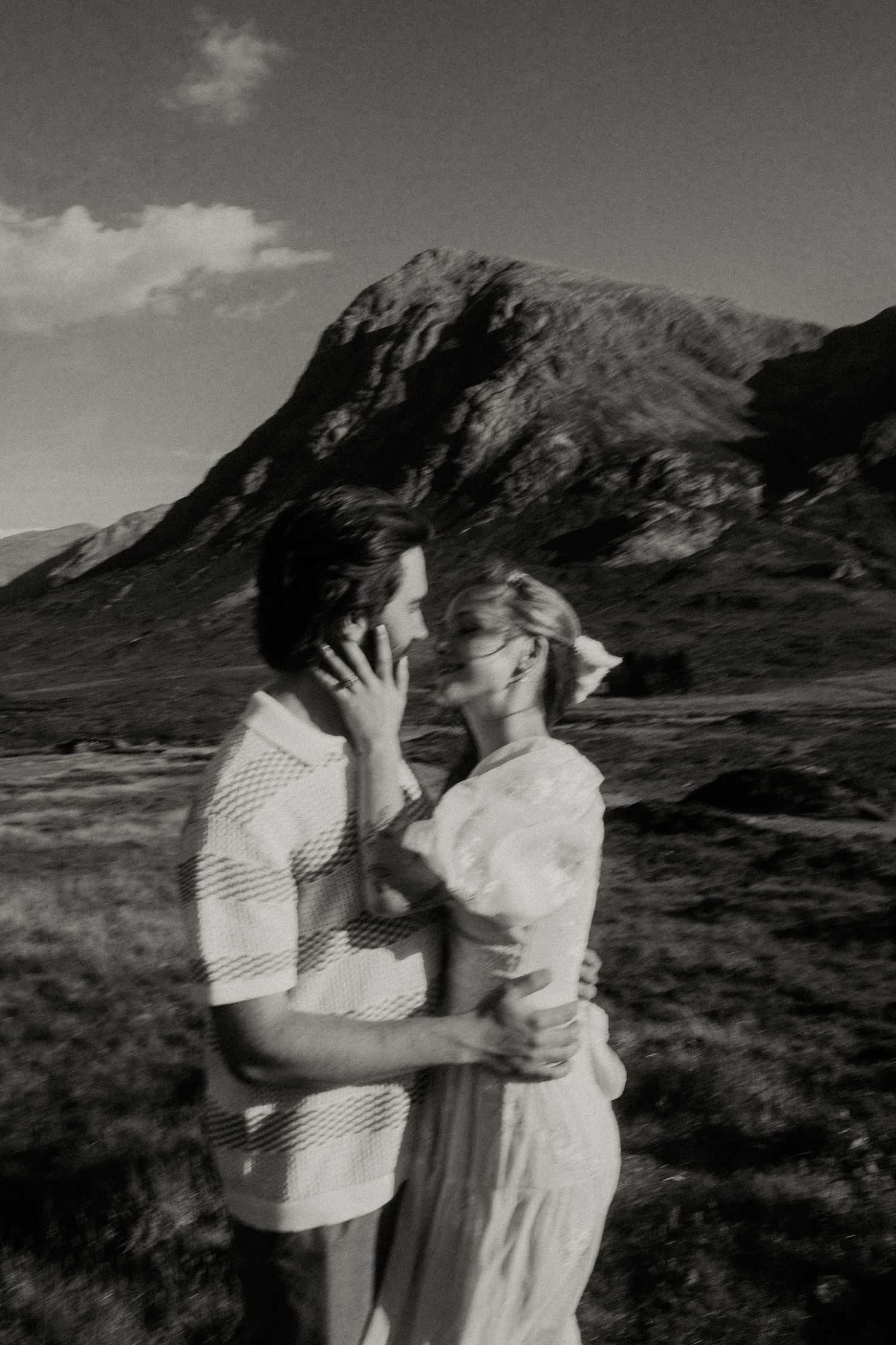A romantic black and white photo shoot in a dramatic mountain landscape.