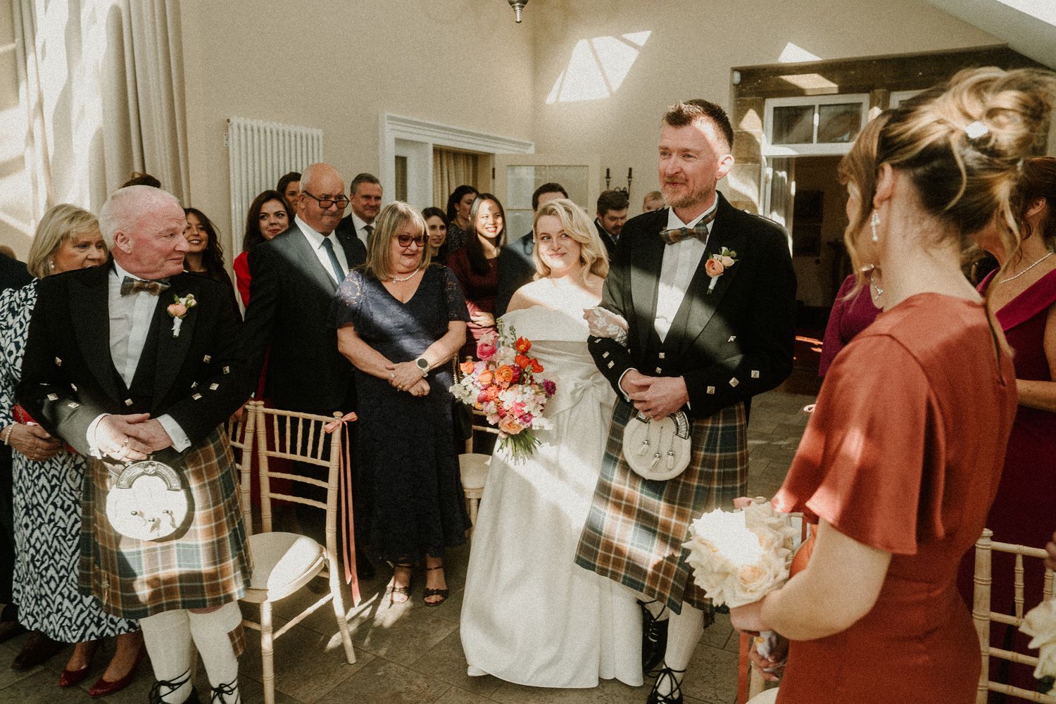 Wedding reception celebration with guests dancing and enjoying festivities.