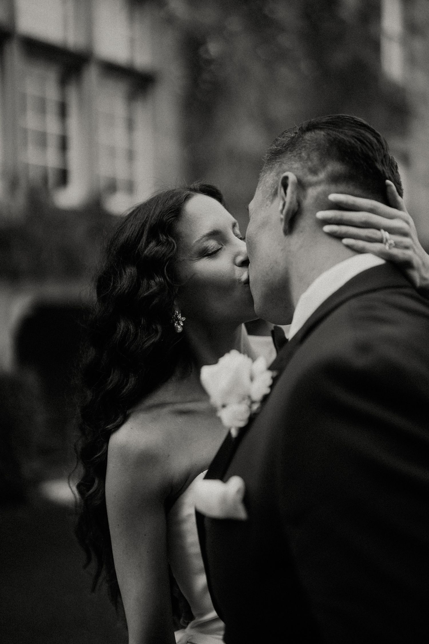 Romantic black and white portrait sequence of newlyweds sharing intimate moments.