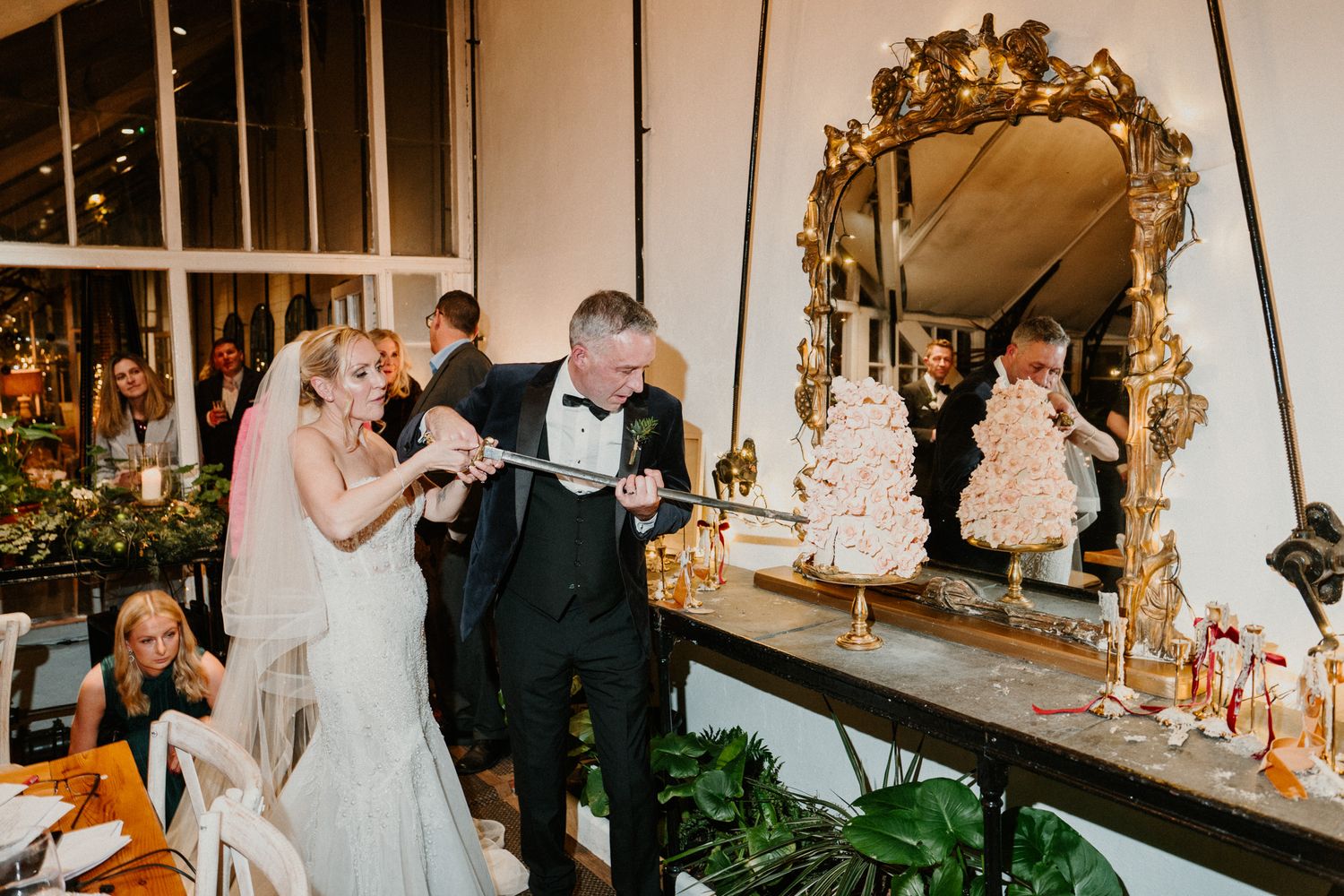 Elegant wedding venue decorated with ornate mirrors and floral arrangements.