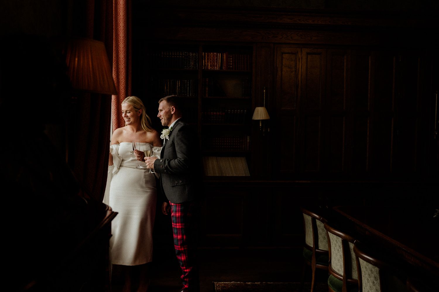 Intimate dance moment captured in a dimly lit ballroom setting.