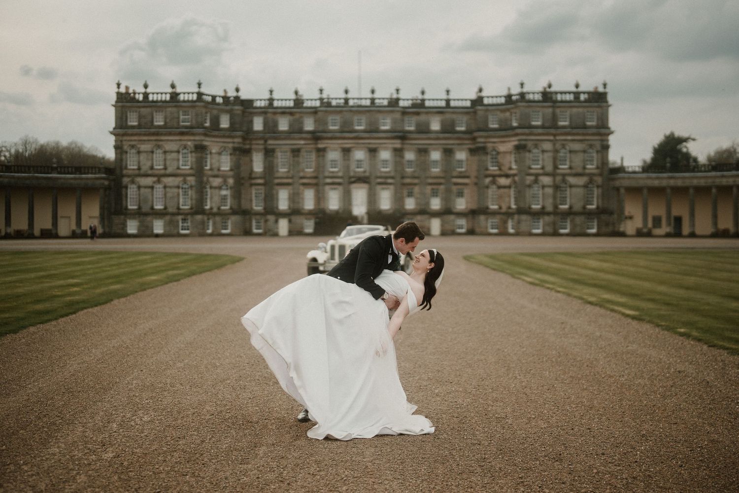 Panoramic view of a majestic Scottish estate with expansive grounds and classical architecture.