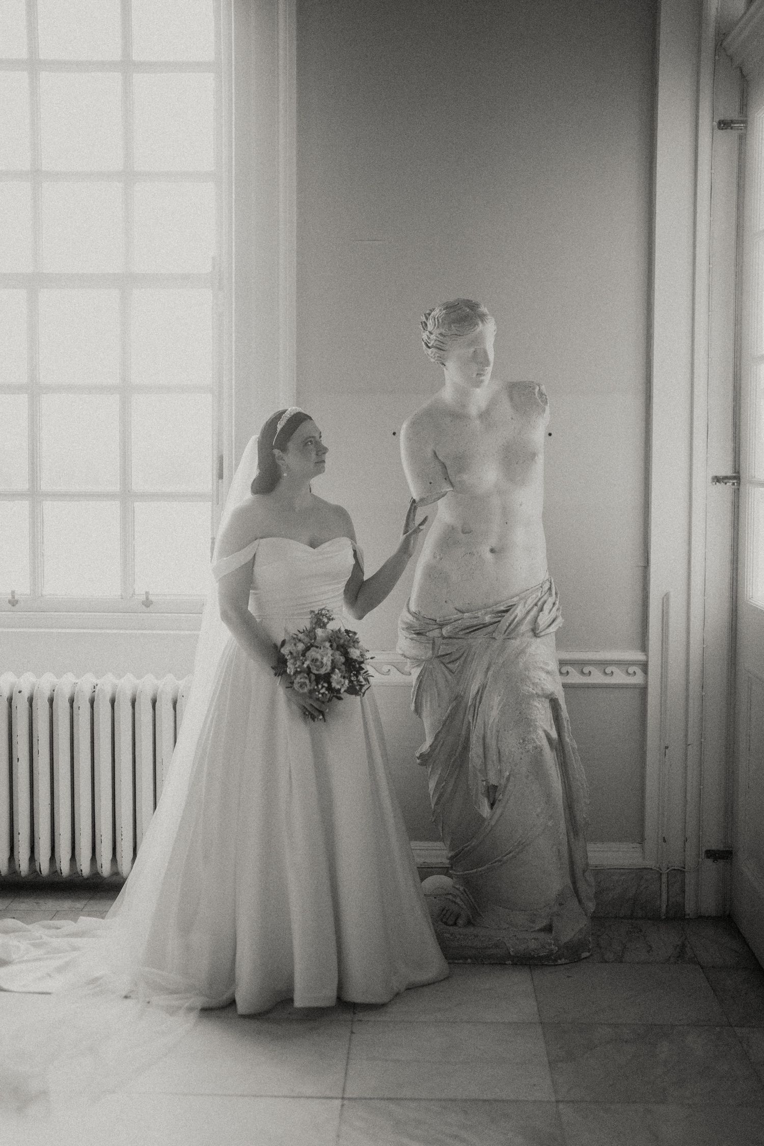 Artistic black and white photos of wedding gowns in a bright window-lit room. Hopetoun House, Scotland.