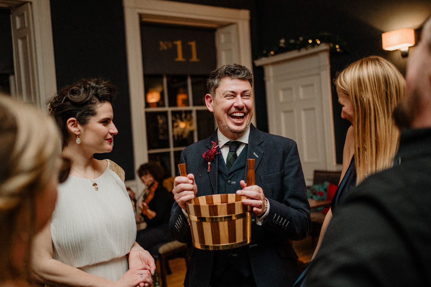 Candid moments captured during an intimate wedding reception party.