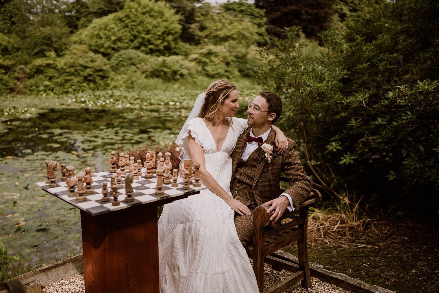Romantic moments captured at a garden wedding with vintage-inspired decor and natural surroundings.