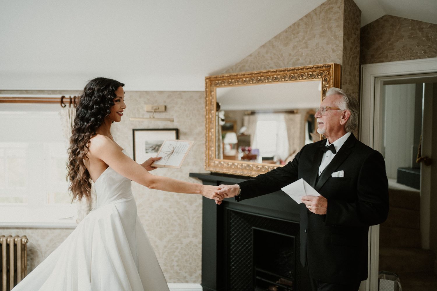 Joyful dance scene in a light-filled room with flowing white dress movement.