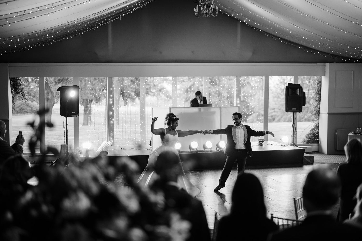 Minimalist panoramic view of an elegant wedding venue with white draped ceiling and ambient lighting.