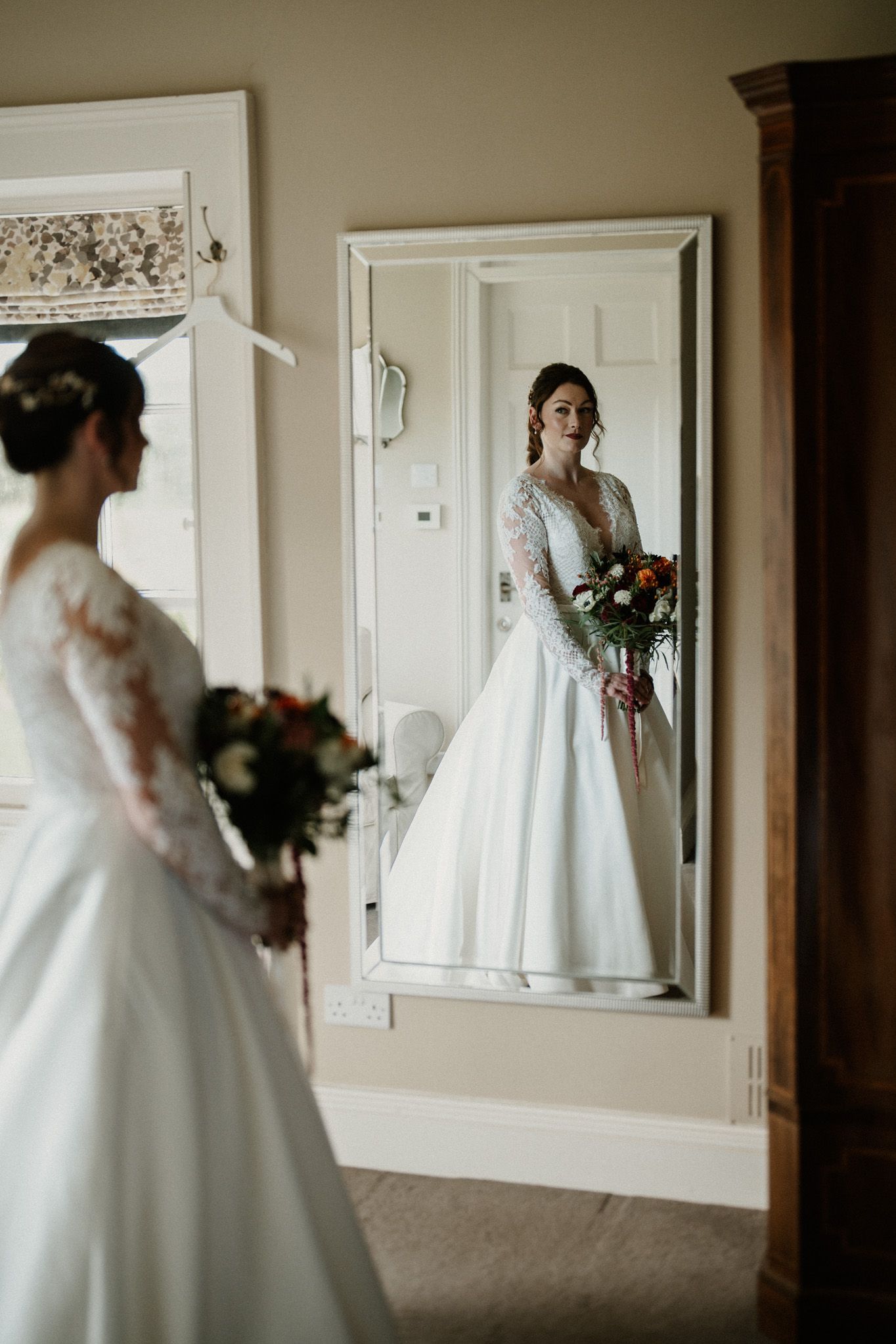Series of reflective moments captured in mirrors showing a wedding dress silhouette.
