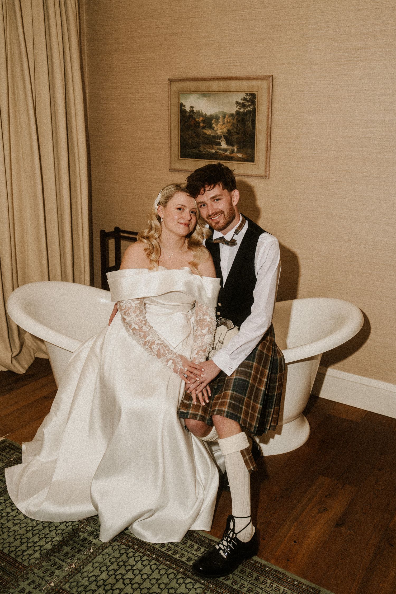 Elegant wedding portraits with the groom in Scottish attire and bride in a flowing white dress.
