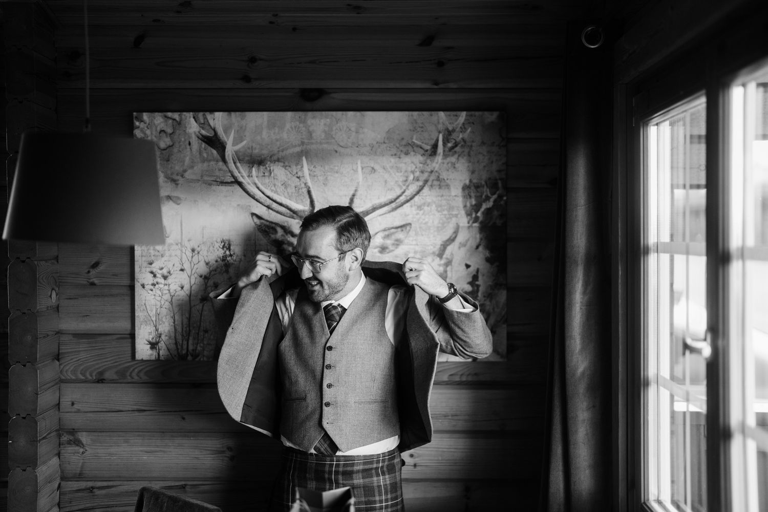Artistic black and white wedding photography series in a rustic wooden interior.