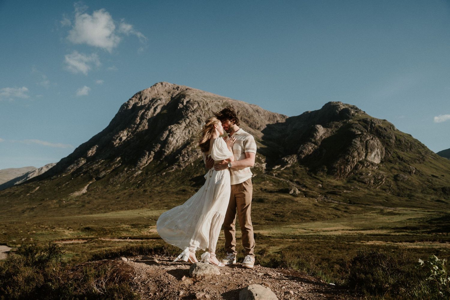 Romantic outdoor photography session in rugged mountain landscape.