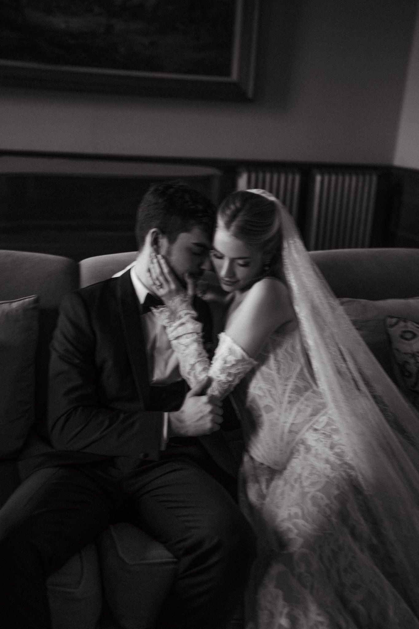A black and white wedding photograph series showing tender moments between a bride and groom sitting together.