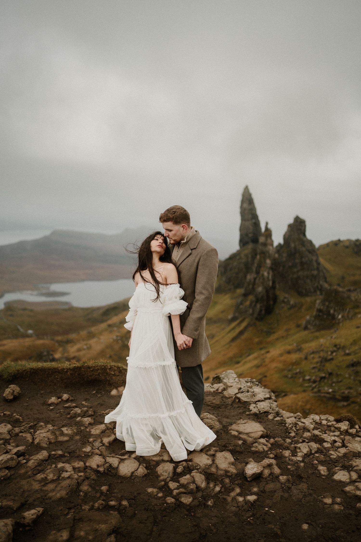 Intimate wedding portraits captured against the majestic backdrop of Scottish highland peaks.