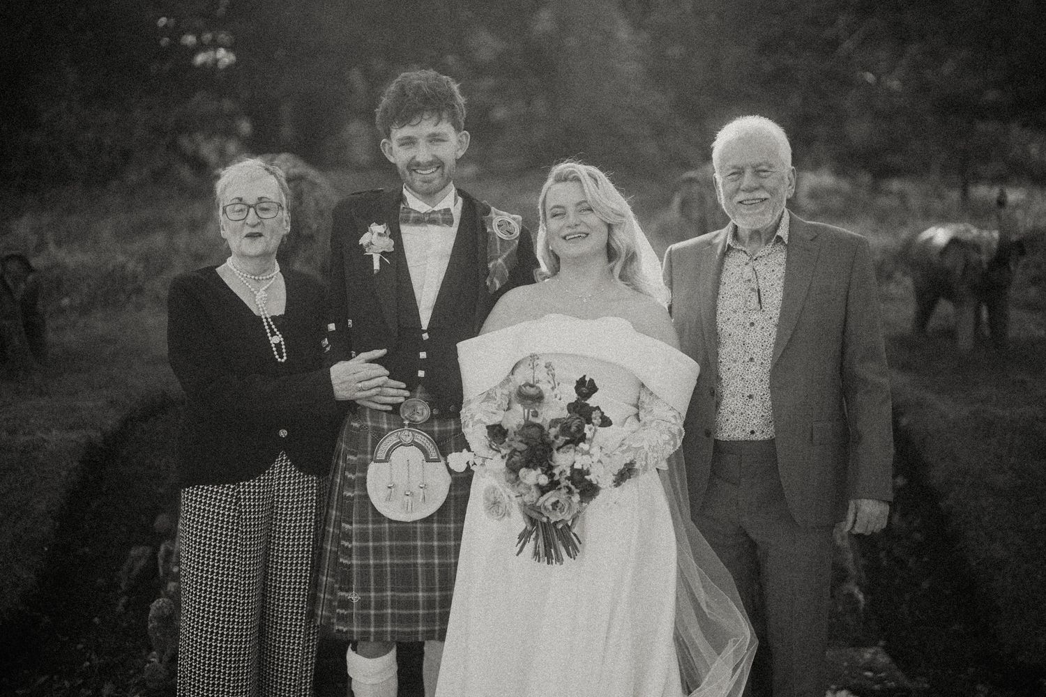 Black and white wedding portraits showcase formal group poses.