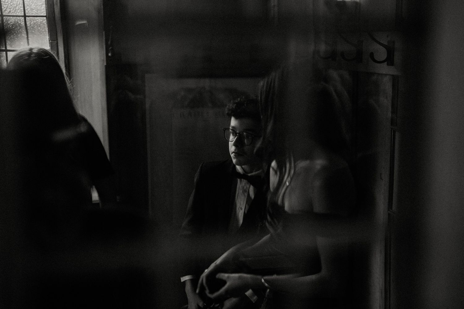 Dark and moody wedding photography with artistic silhouettes.