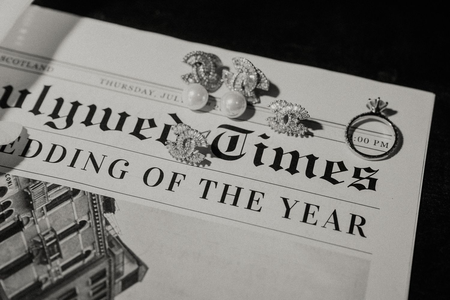 Close-up of vintage newspaper headlines and typography in black and white.