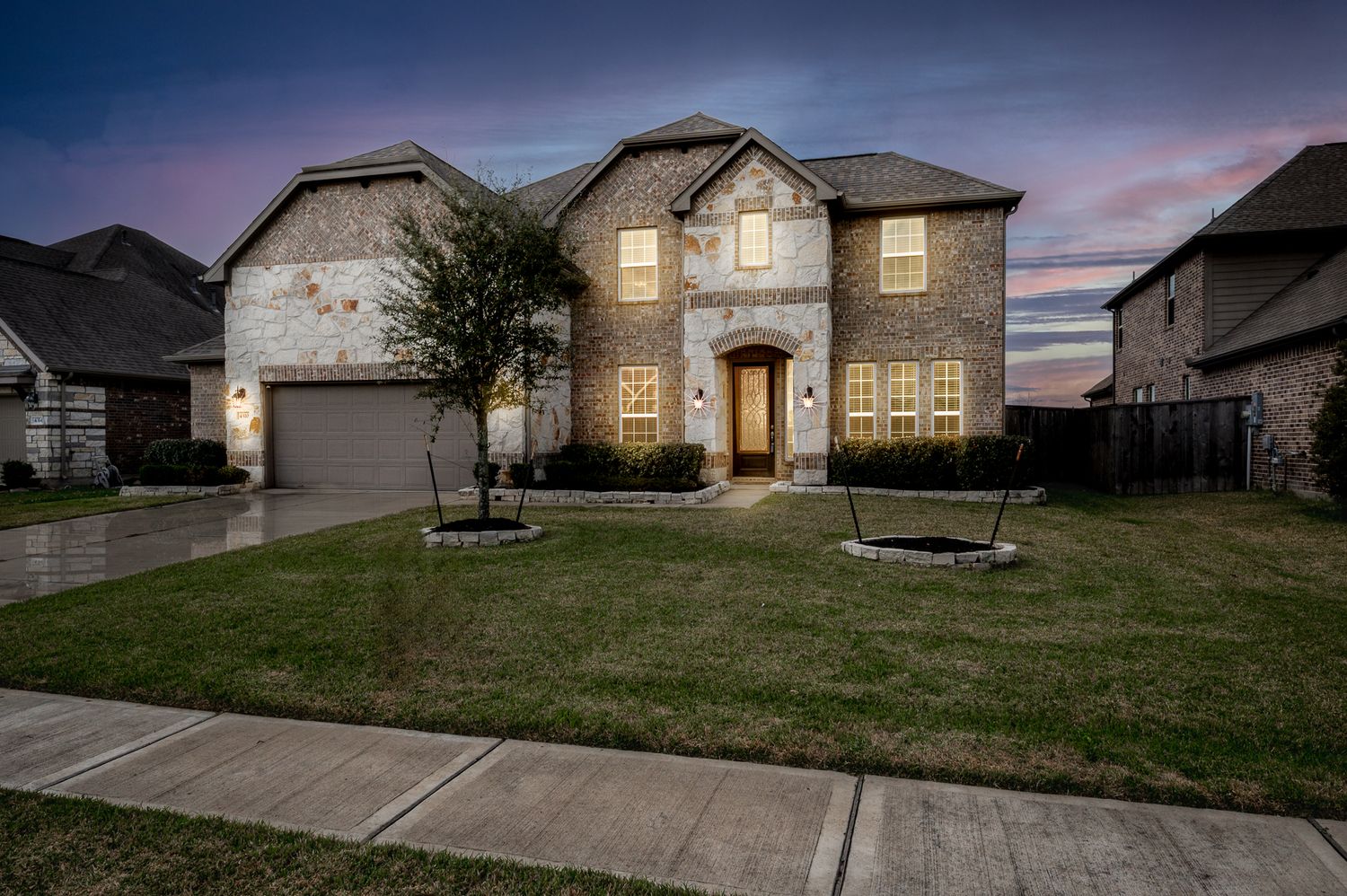 4310 markstone ridge lane in Rosharon Texas large stone home for sale with a twilight sky from a real estate photographer