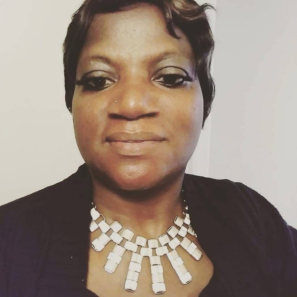 Portrait of owner Deborah Harris smiling, representing compassionate leadership and lived‑experience support.