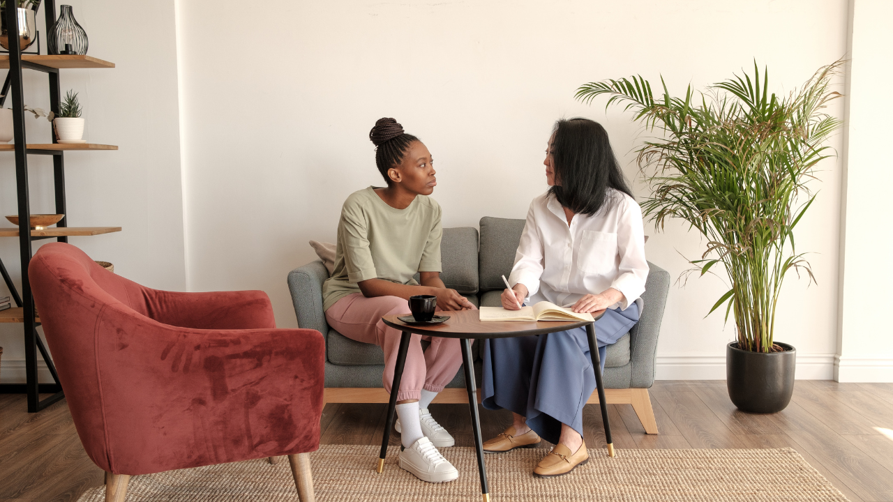 A woman in a counseling session offering calm, supportive guidance.