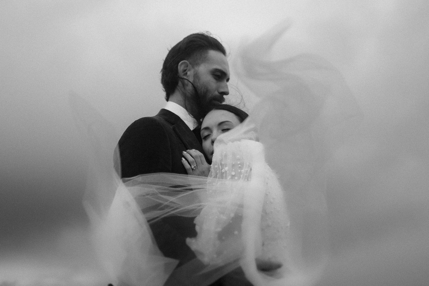 Romantic black and white wedding photo sequence showing tender moments between a couple.
