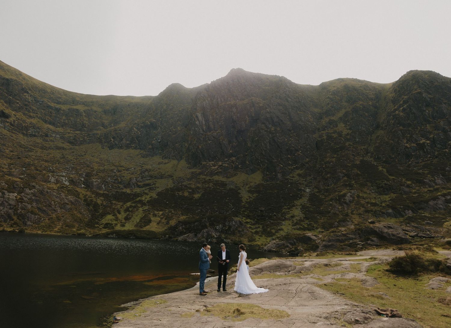 Elopement ceremony in Dingle surrounded by mountain views and a lake.