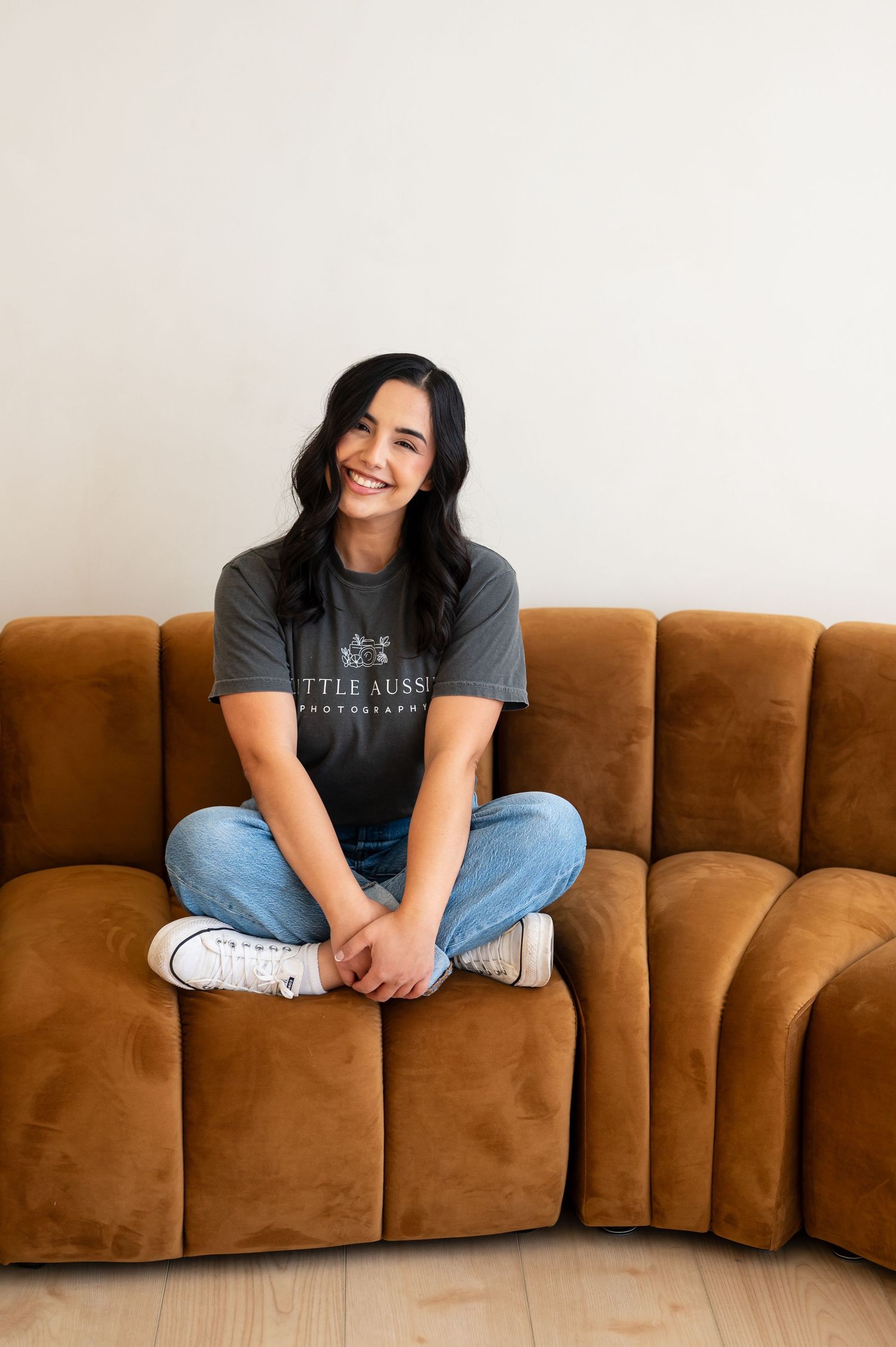 Casual lifestyle portraits on a brown velvet sofa against white background.