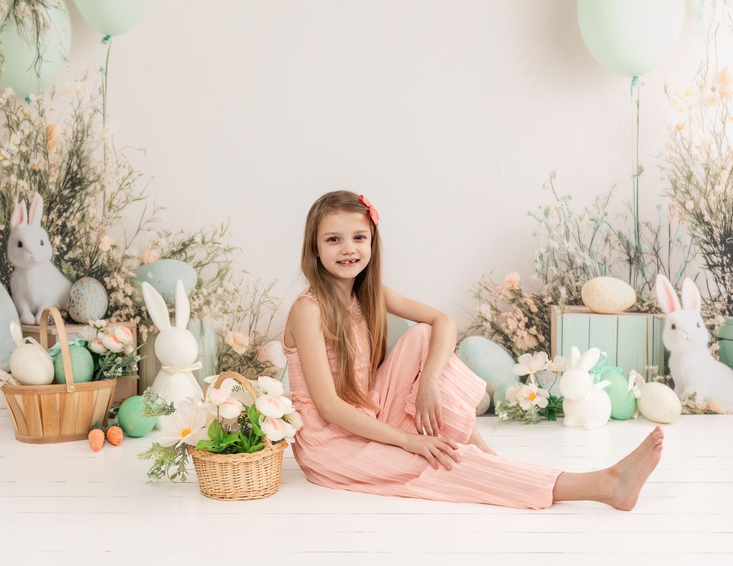 Soft pastel spring setting with white decorative elements and natural accents.