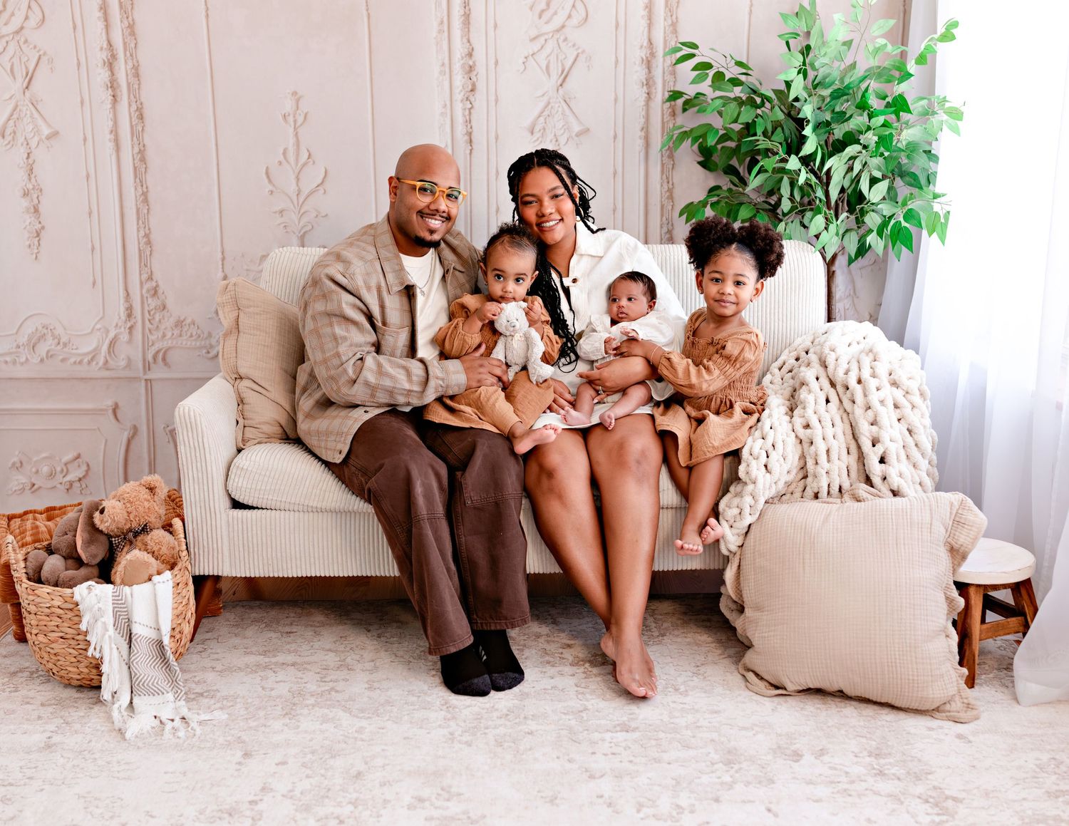 A collage of family portraits in neutral tones showing tender moments between parents and children on a beige couch.