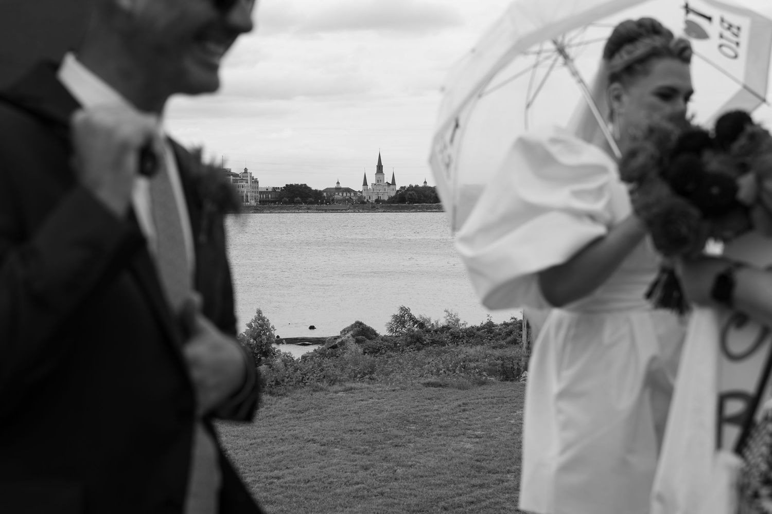 Black and white panoramic sequence of wedding celebration moments outdoors.