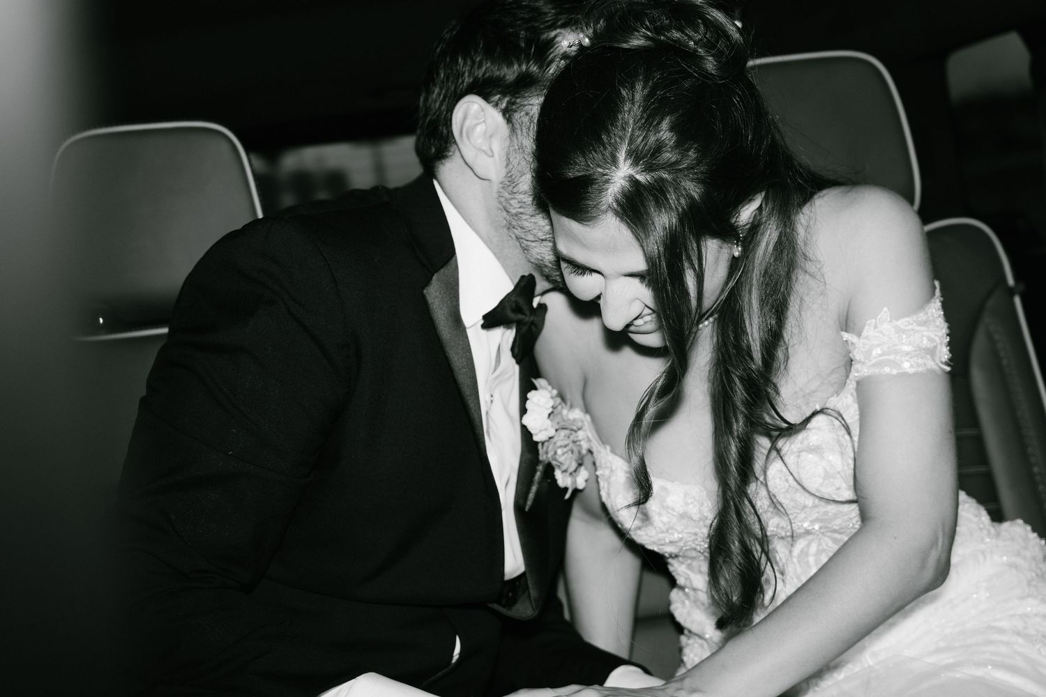 Romantic wedding reception moments captured in dramatic black and white photography.
