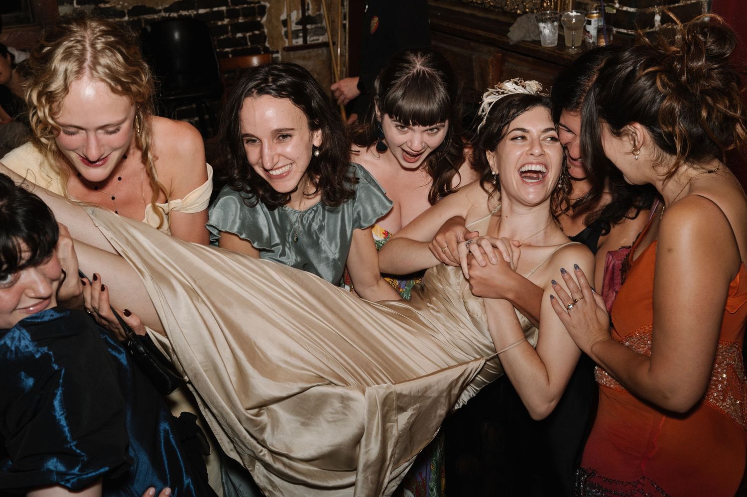 Wedding guests dancing and celebrating at a reception party.
