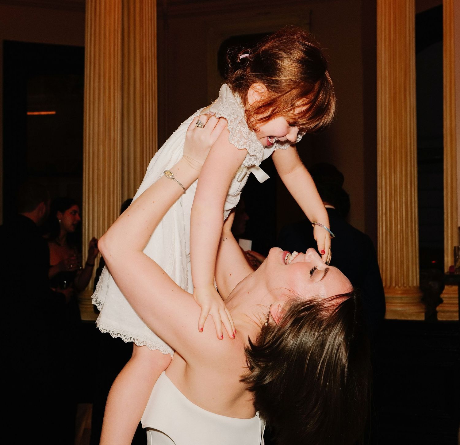 Romantic dance floor moments captured at a wedding reception.