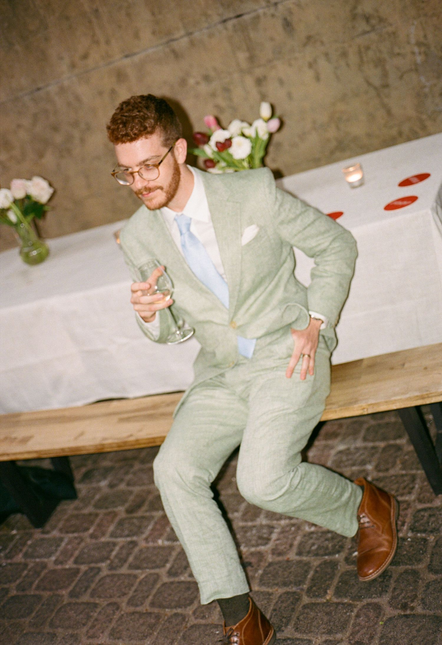 Groom dancing at wedding reception, documentary wedding photography by Palm Meadow Weddings