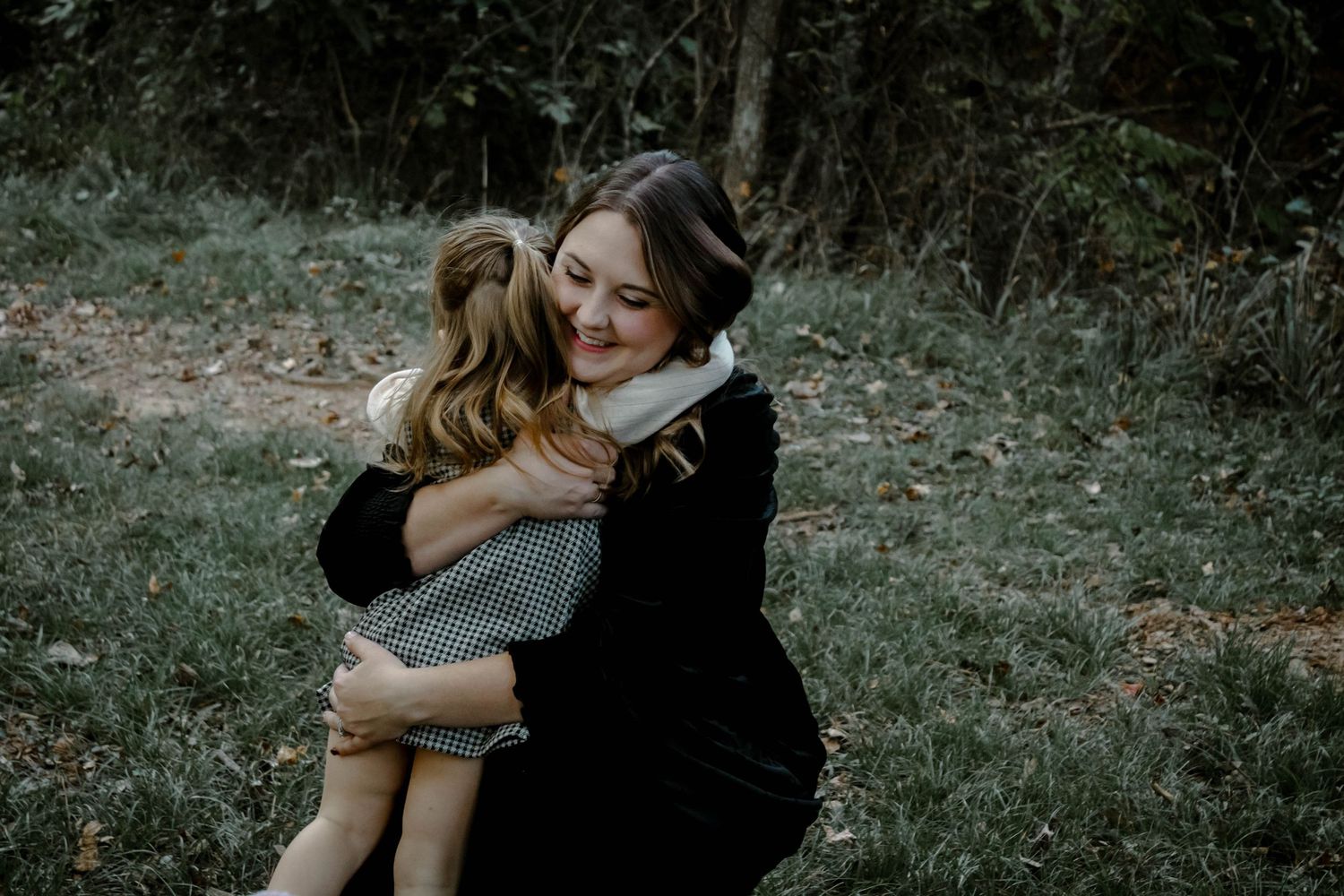 A series of romantic outdoor photos showing tender embraces between two people in a natural setting.