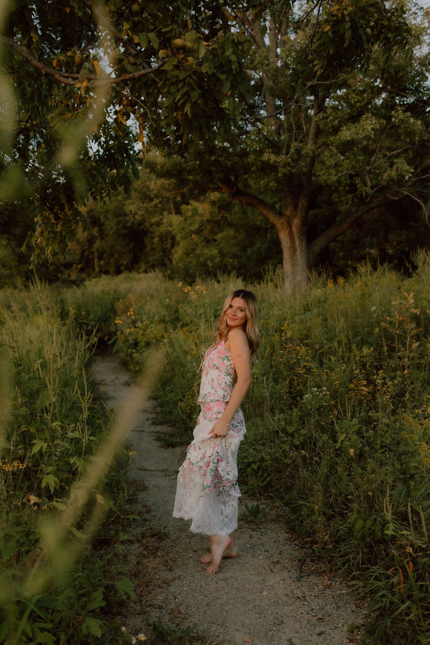 Candid walking shots along a nature path surrounded by wildflowers and greenery.
