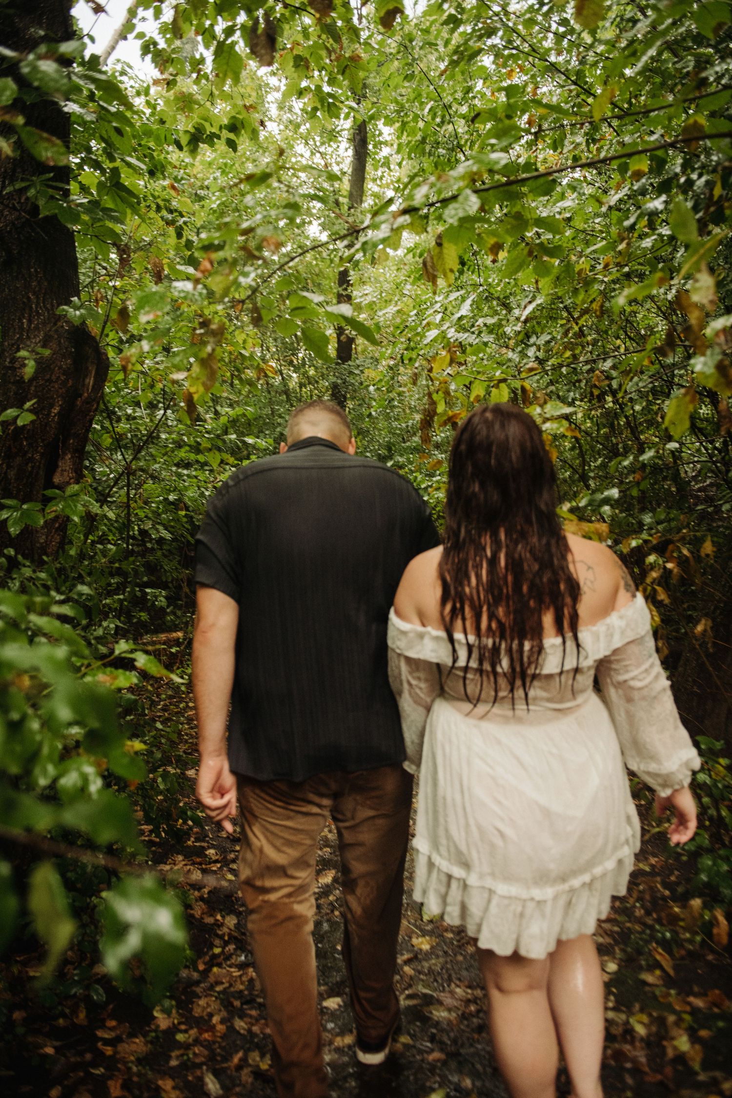 couple in engagement pictures in woods