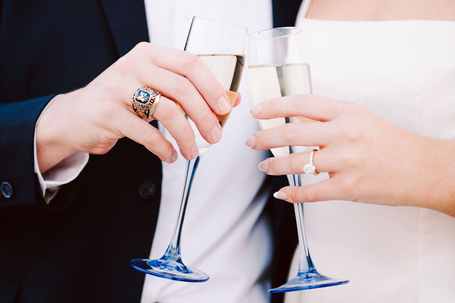engagement pictures two hands clinking champagne flutes