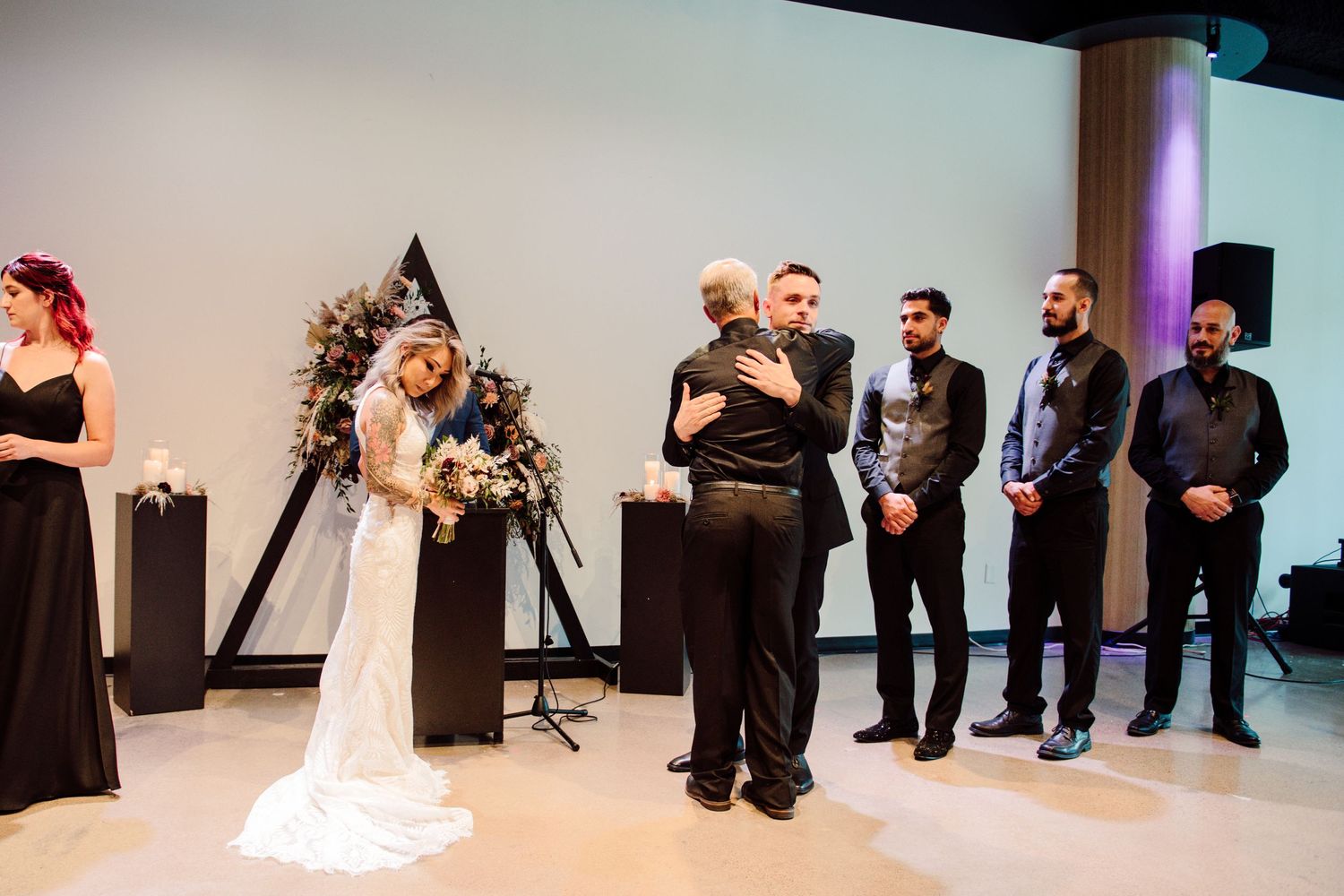 bride and groom at altar