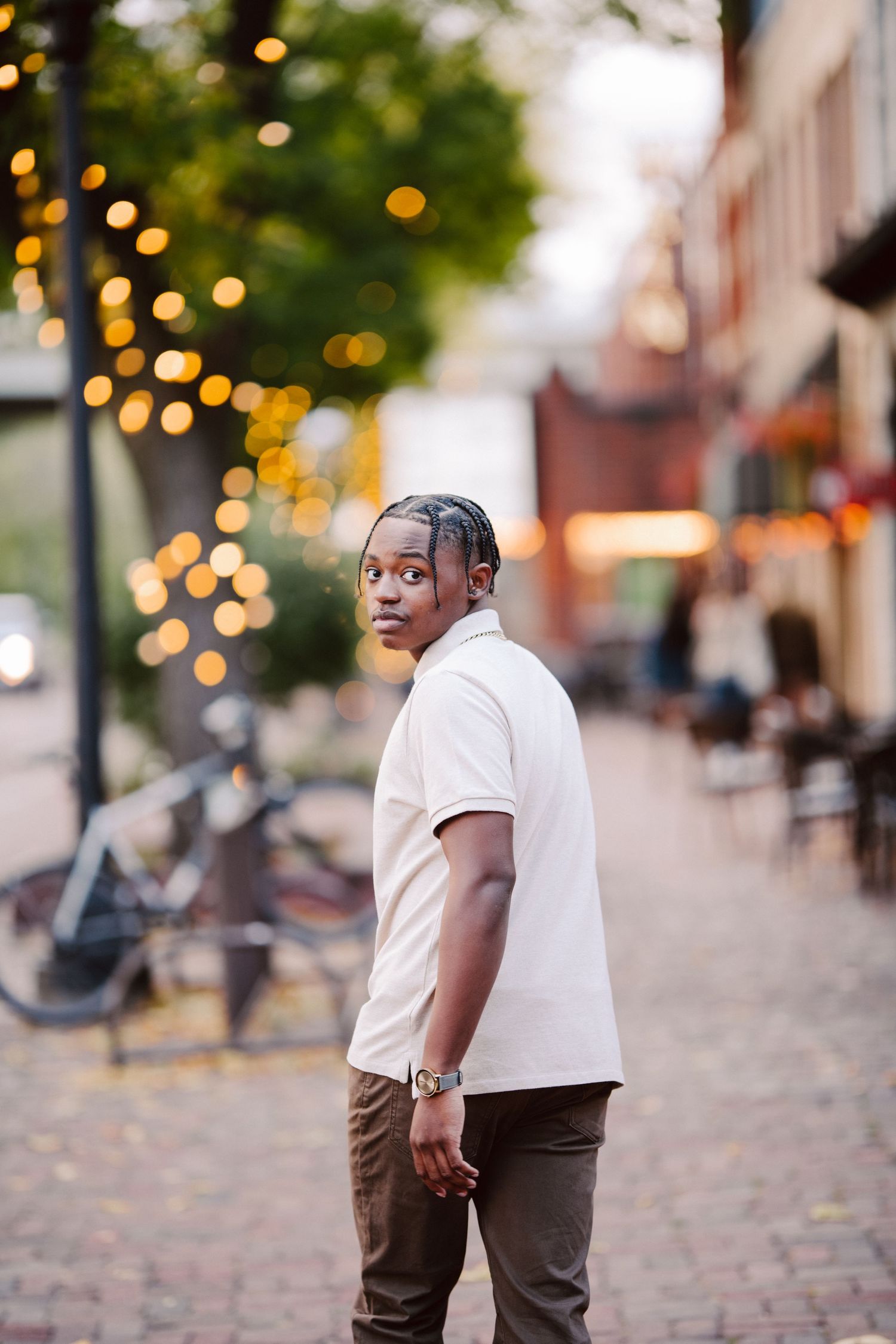 senior guy pictures in minneapolis walking down road