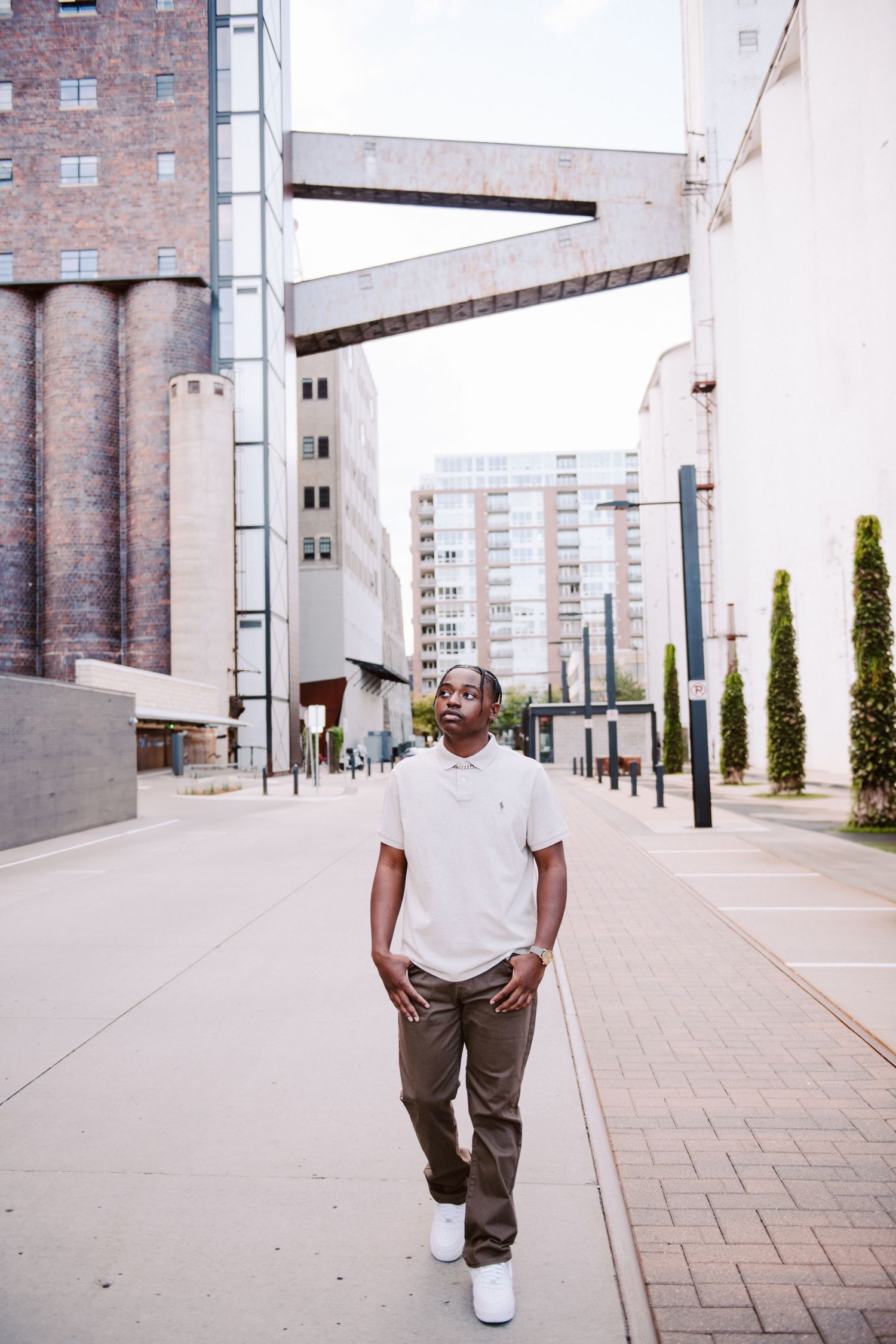 senior guy pictures in minneapolis walking down street