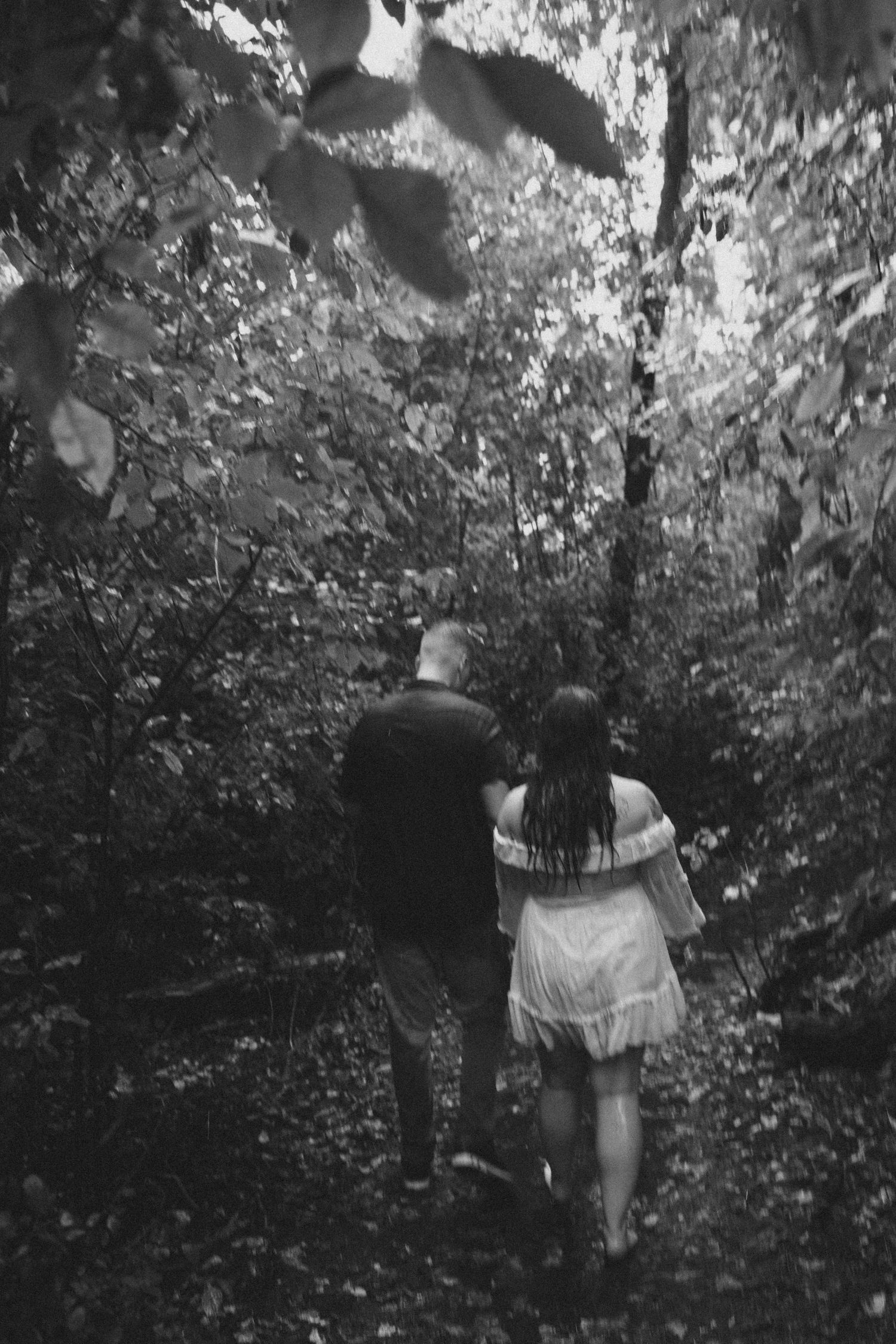 couple in engagement pictures in woods