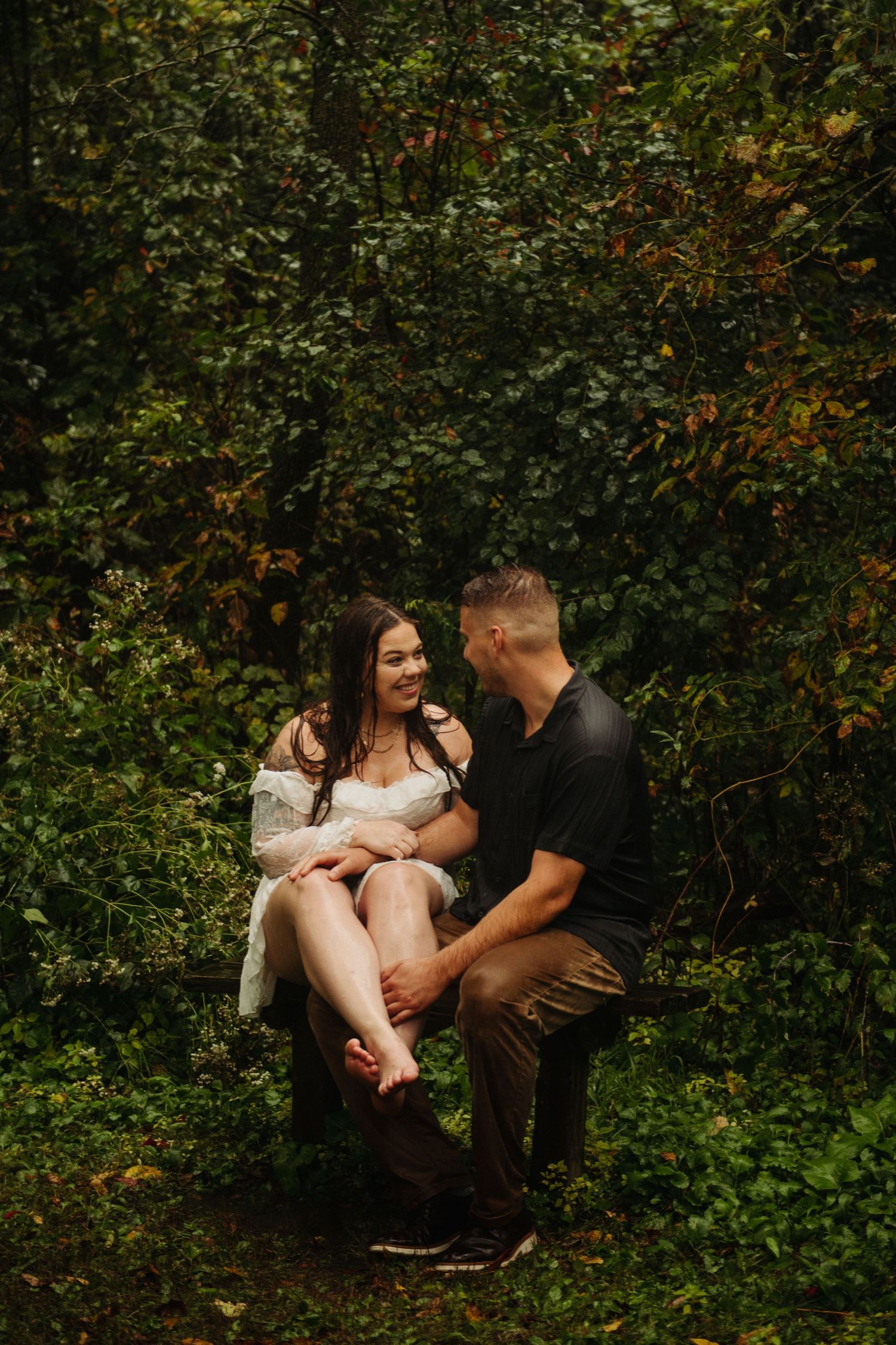 couple in engagement pictures in woods