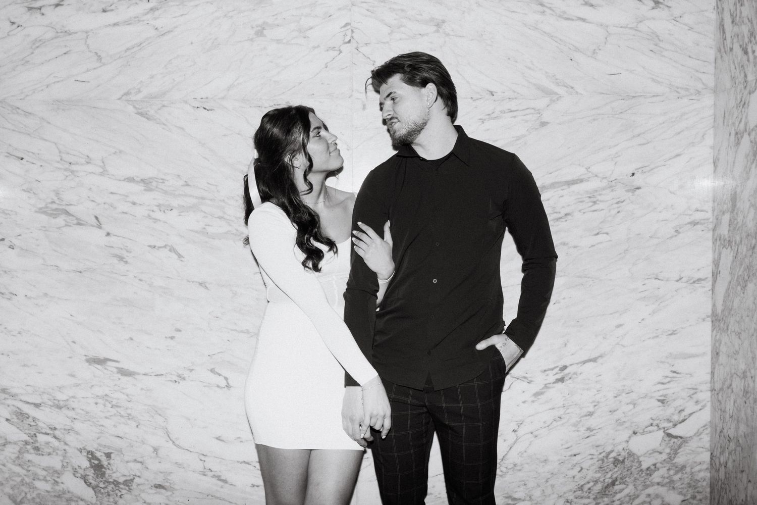 engagement photo of couple with direct flash  in hotel in minneapolis
