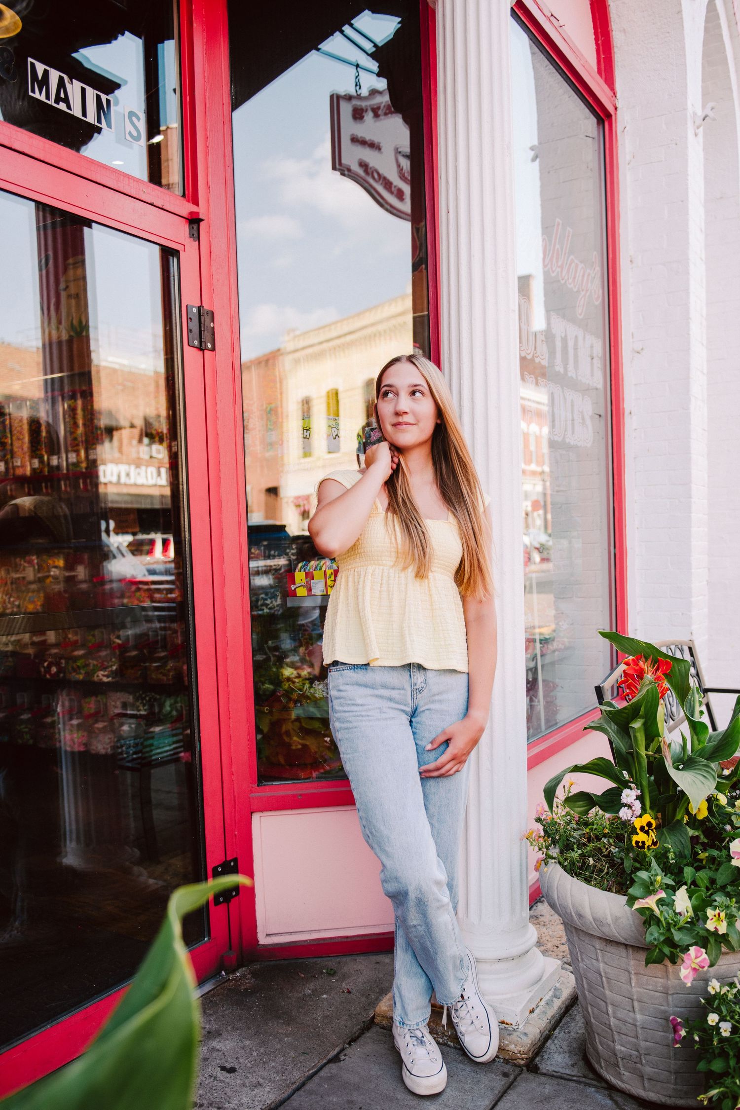 high school senior girl pictures leaning against wall