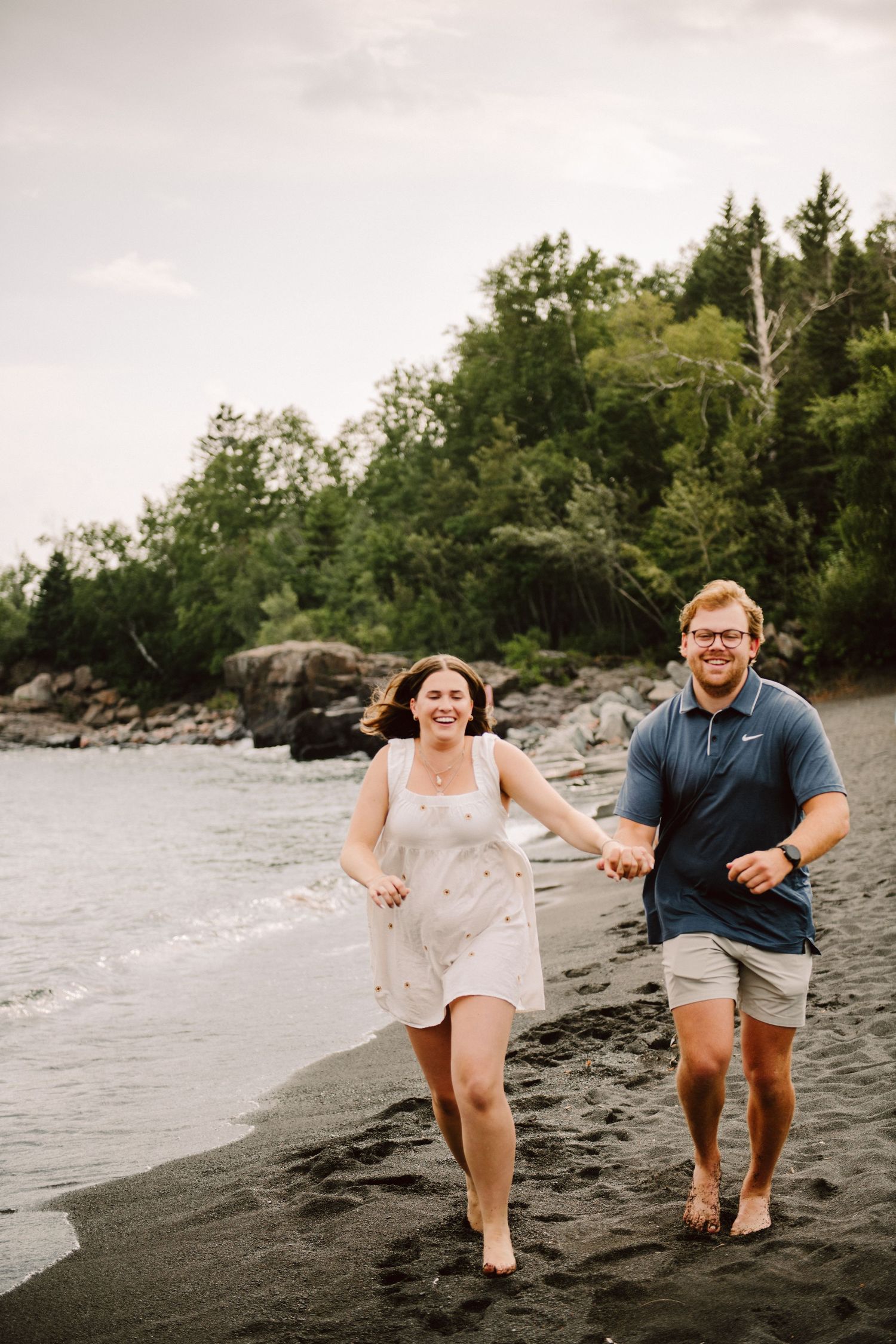 couple engagement pictures black sand beach