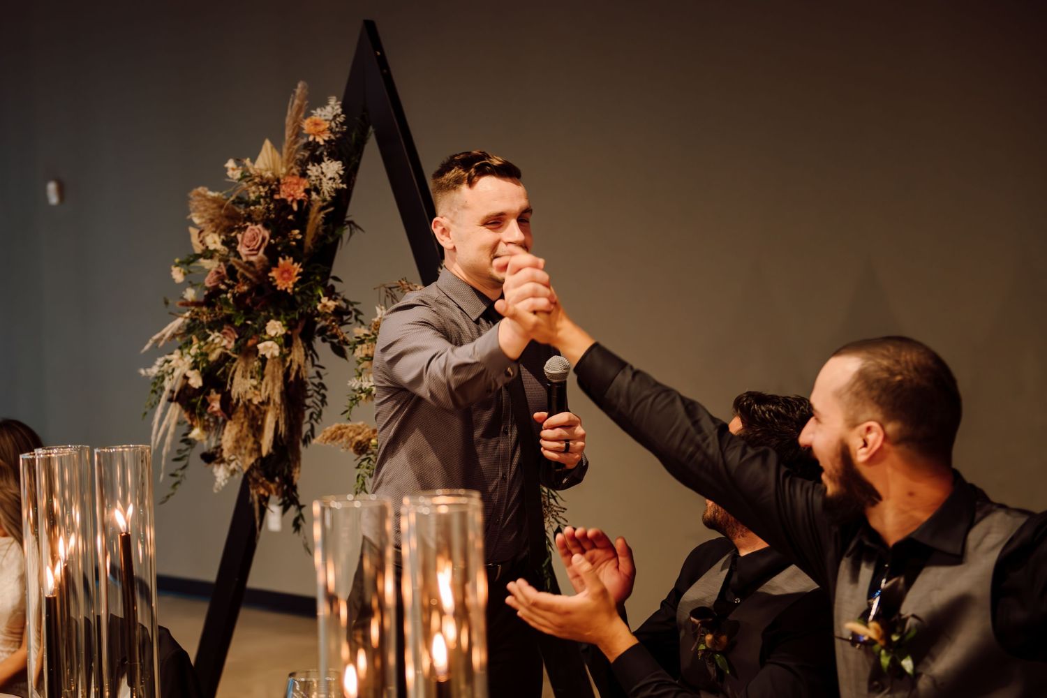 man giving speech at wedding reception
