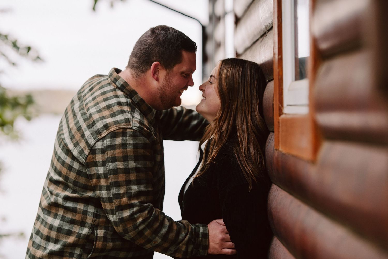 man and woman at a cabin