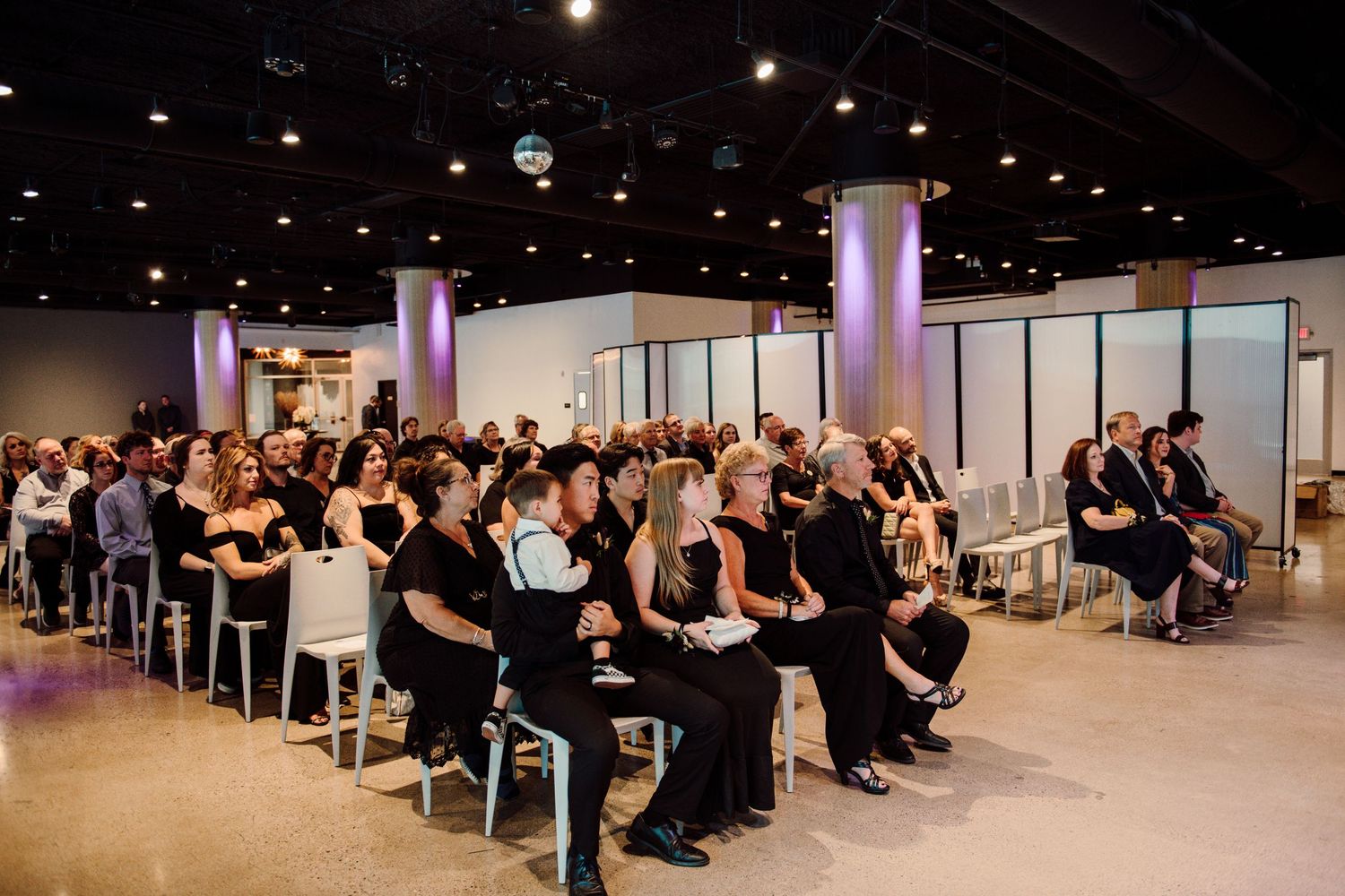 wedding guests sitting in crowd